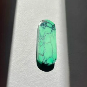 A beautifully cut variscite mineral with vibrant green hues