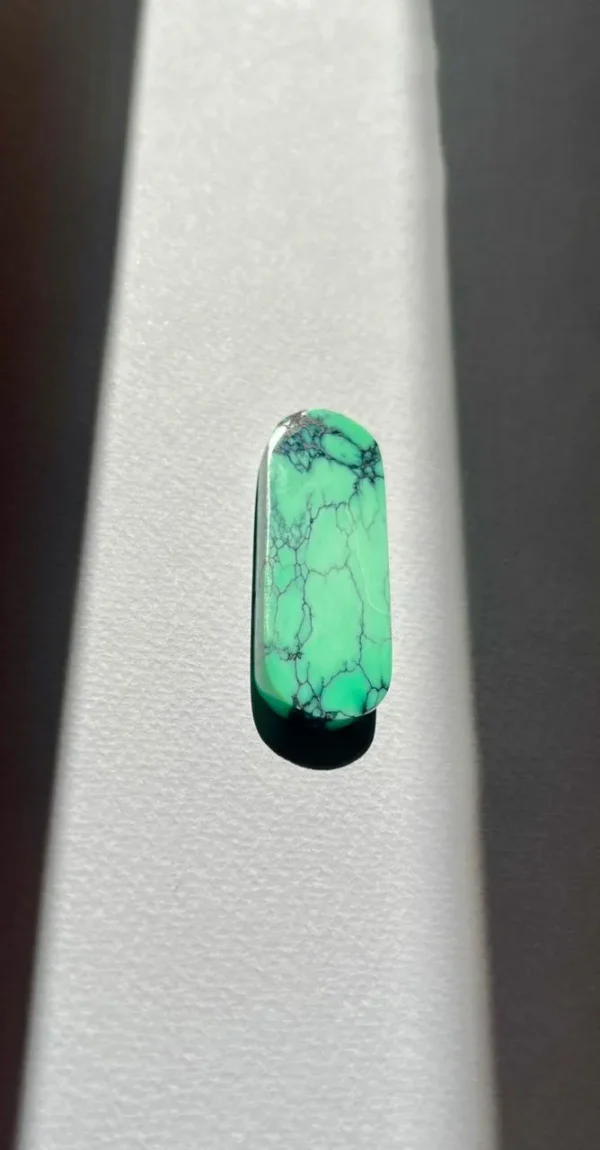 A beautifully cut variscite mineral with vibrant green hues